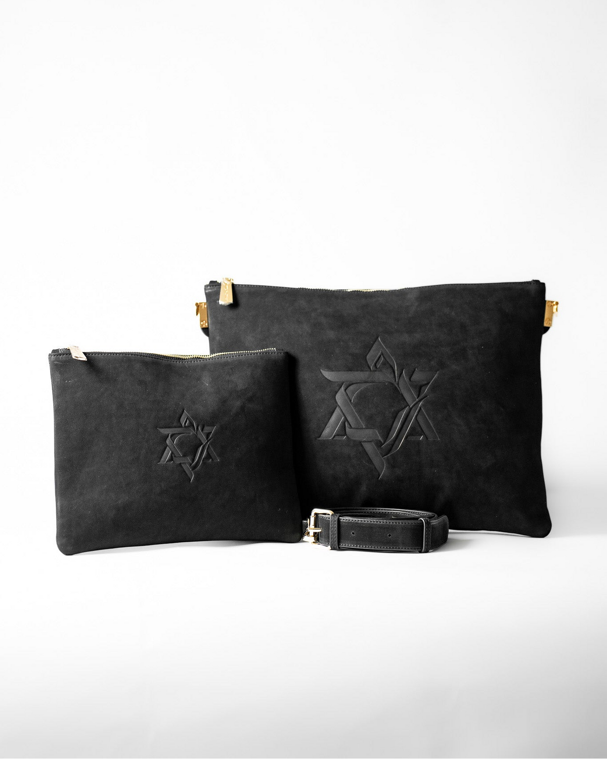 Black Magen David leather tallit bag and tefillin bag set with a strap on a white background