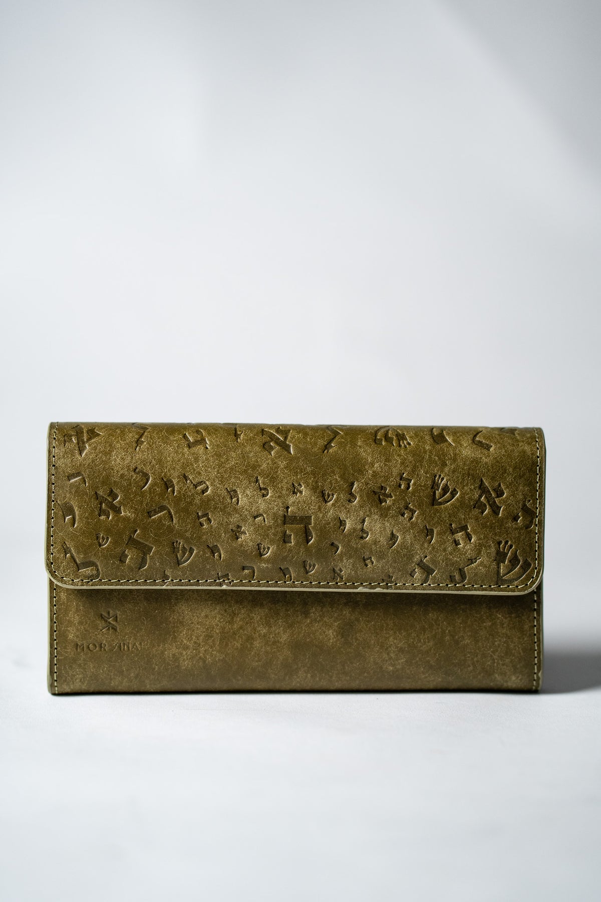 Green embossed leather ladies wallet closed, front view