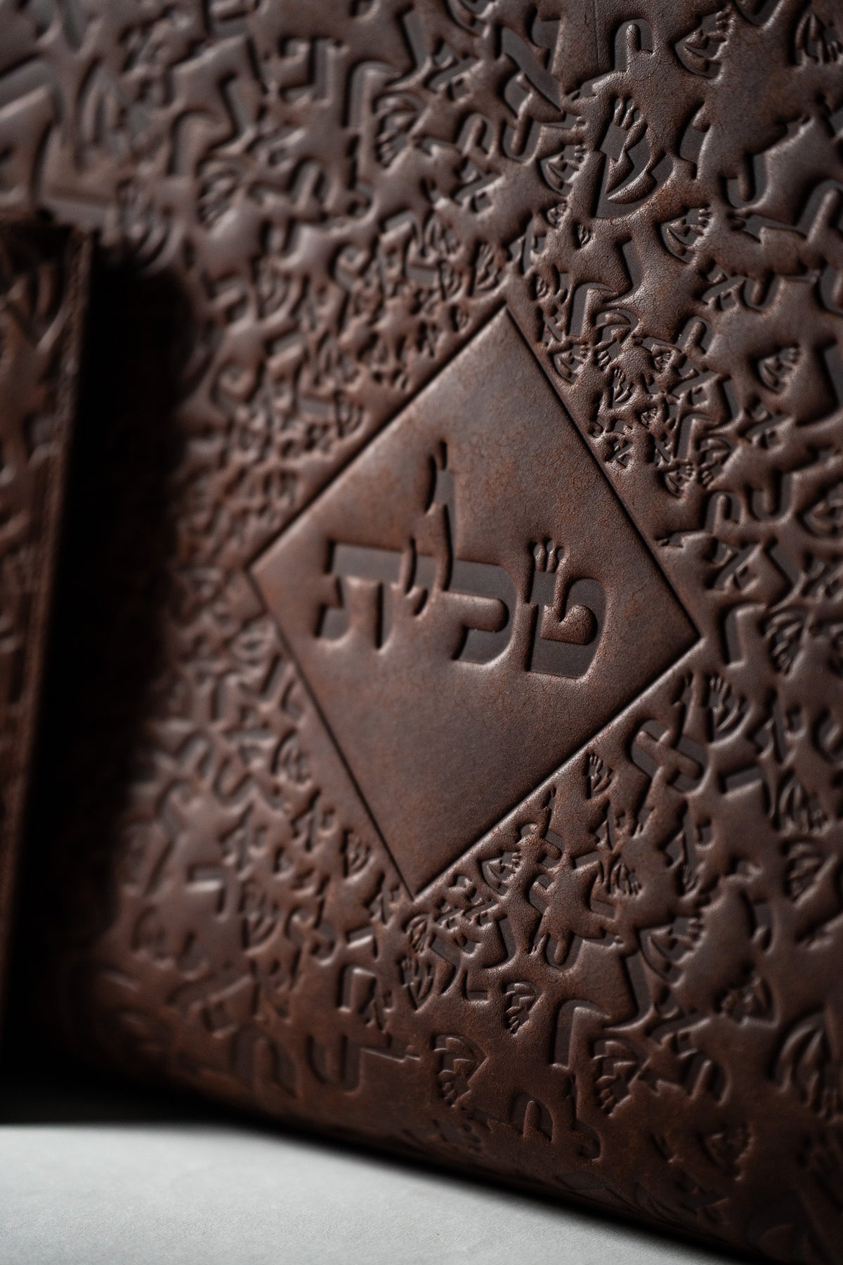 Close-up of embossed Israel Letters on brown Pueblo leather
