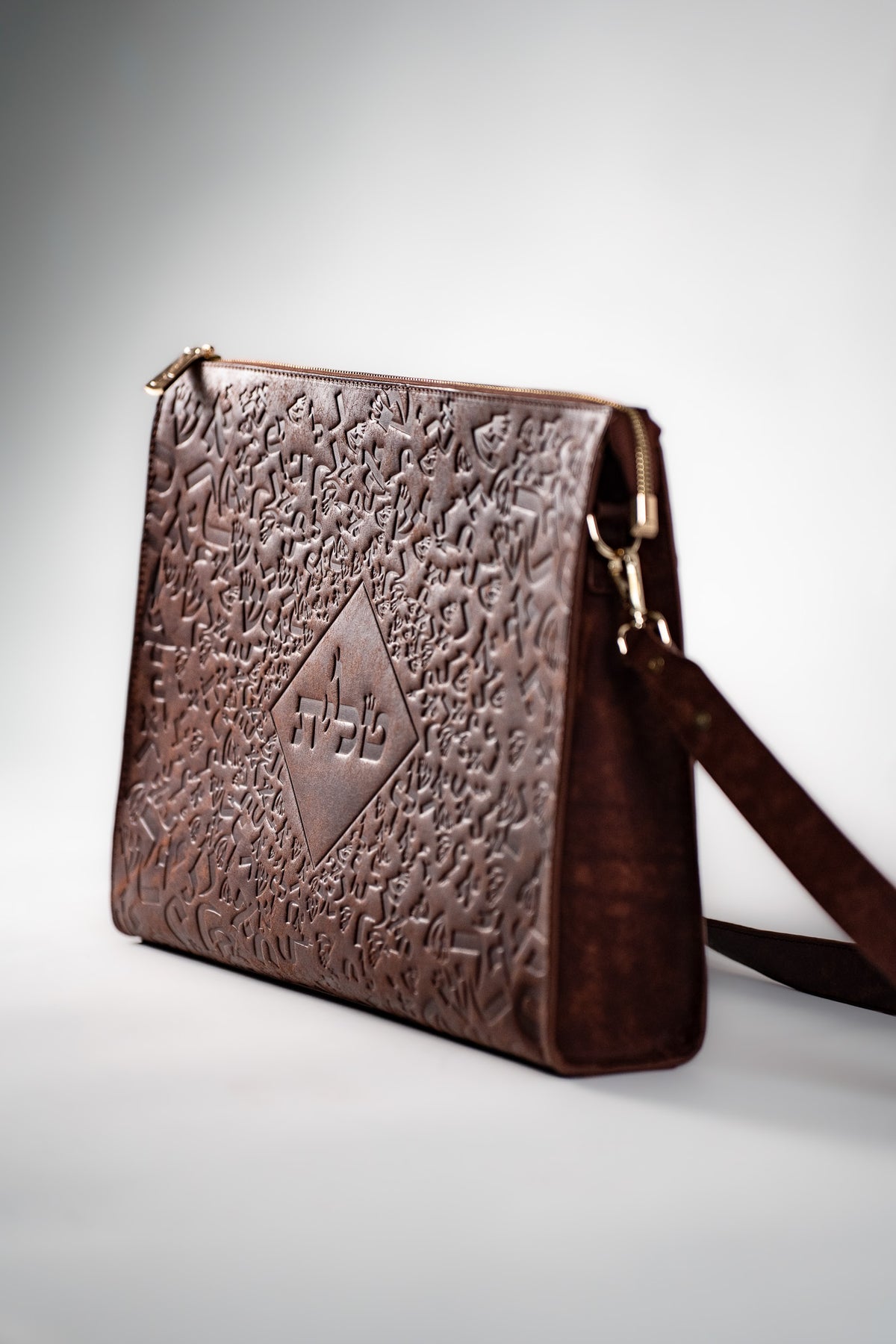 Brown Chabad leather tallit bag with a strap, side view