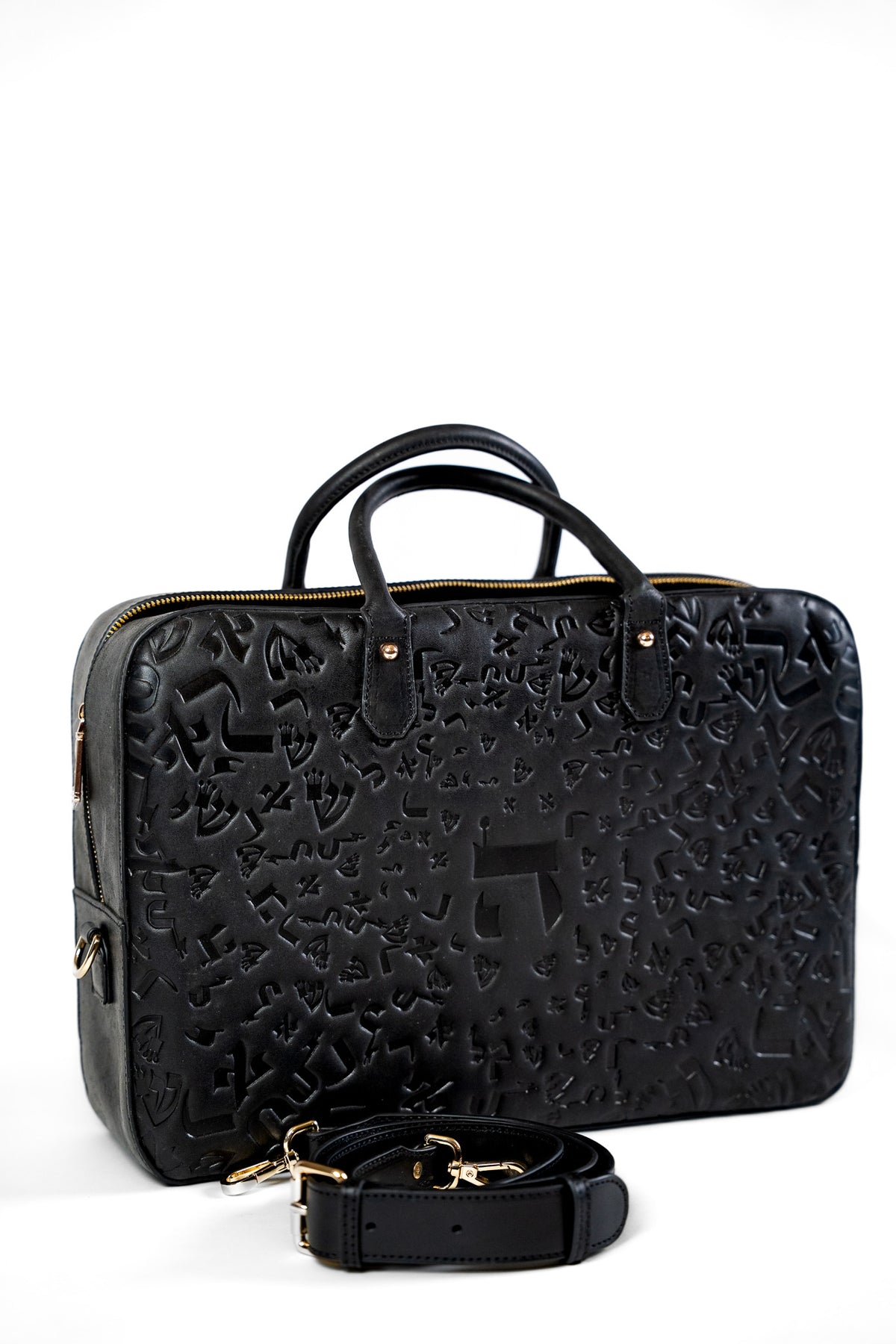 Black embossed leather laptop bag with two handles, three quarter view