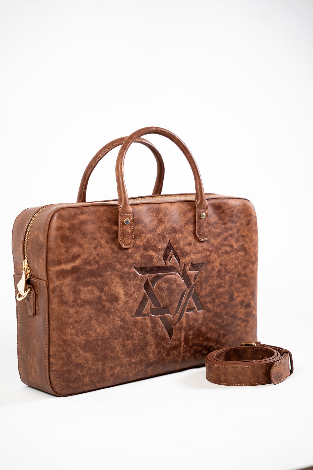 Brown leather Magen David bag with a detachable strap on white